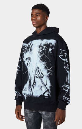 Signature Guapi cross emblem branding on black graphic hoodie