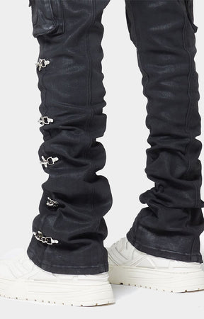 GUAPI Obsidian Black Waxed Cargo Denim crafted from heavyweight black denim with a matte wax finish, multi-panel construction, cargo pockets, silver cross-lock hardware, reinforced stitching and natural ankle stacking. Straight-slim silhouette with a true-to-size fit.