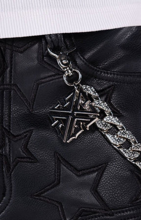 Leather shorts with detachable metal chain accessory and custom hardware.