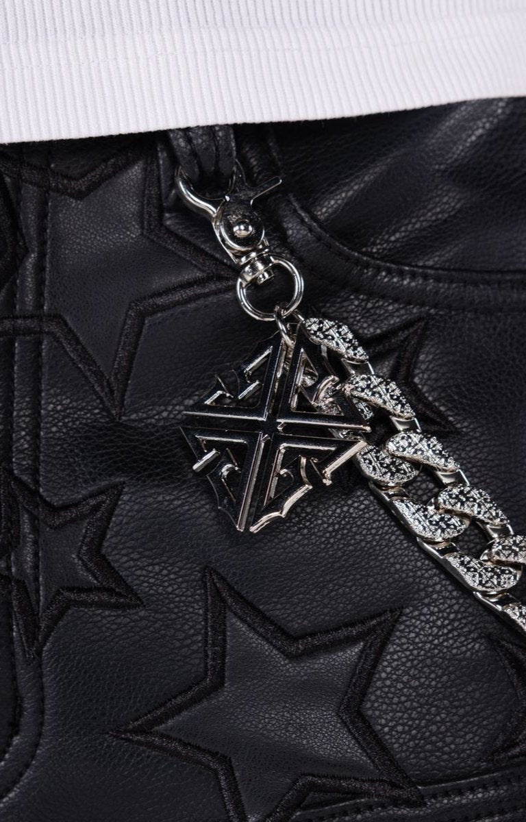 Leather shorts with detachable metal chain accessory and custom hardware.