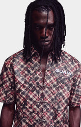 Guapi Charcoal Plaid Leather Shirt front view with Charcoal plaid pattern detail, Toggle closure detail & Embroidered GUAPI chest logo.