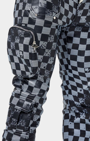 Chrome zipper and snap button hardware on Guapi leather pants