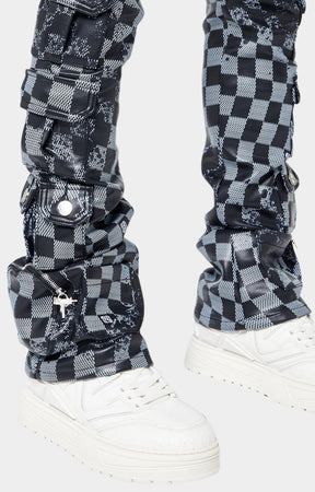 Heavy stacked leg fit of Guapi leather pants over sneakers