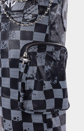 Cargo pocket detail on Guapi Checkerboard Leather Cargo Shorts.