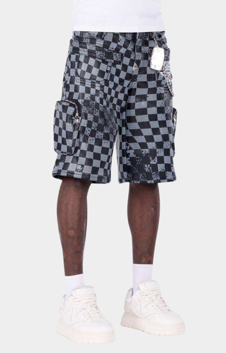 Chain accessory detail on Guapi Checkerboard Leather Shorts.