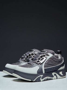 Guapi Cloud Grey Skate Star Sneakers featuring grey and charcoal panels, studded detailing, oversized laces, GUAPI metal hardware, graphic tongue patch, and sculpted sole.