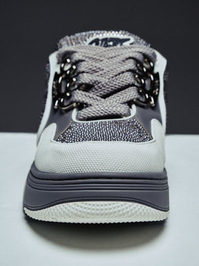 Guapi Cloud Grey Skate Star Sneakers featuring grey and charcoal panels, studded detailing, oversized laces, GUAPI metal hardware, graphic tongue patch, and sculpted sole..