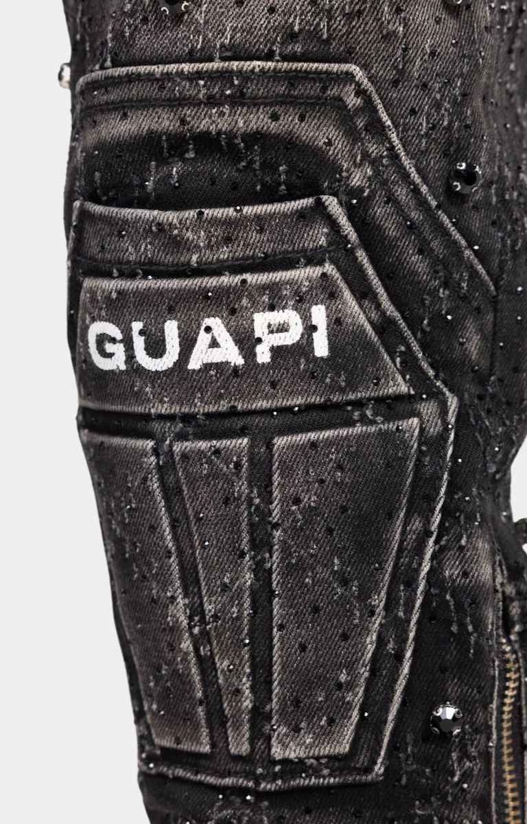 Coffin shaped knee panel detail on guapi black coffin arc embellished denim. 