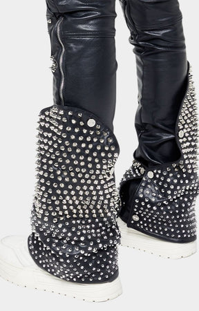 GUAPI logo branding on knee panel of leather pants.