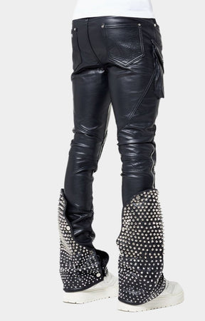 Chrome spike and pyramid stud texture on Guapi flare panels.