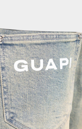 Premium silver hardware detail on GUAPI aviation clasp shorts.