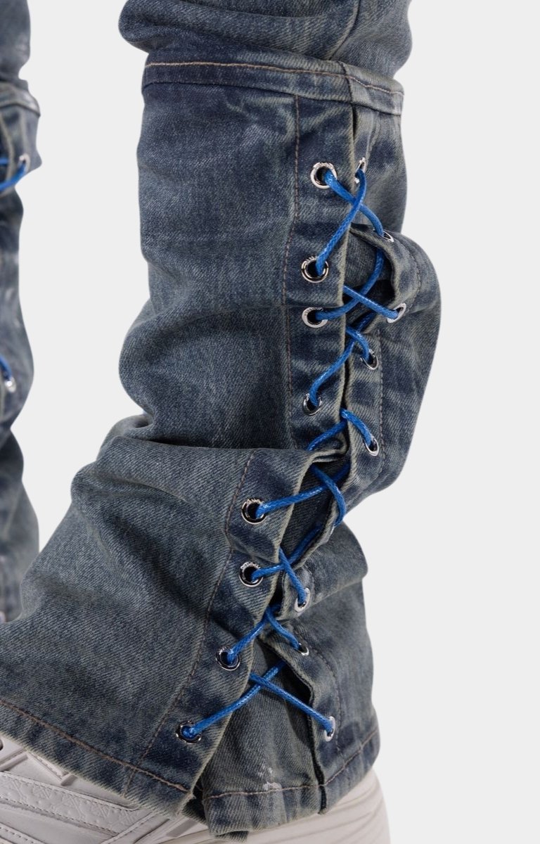 Designer stacked denim jeans crafted for luxury streetwear fashion.