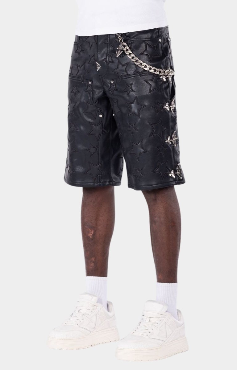 Black leather shorts featuring all-over embossed star detailing with metal chain and buckle design on sides. 
