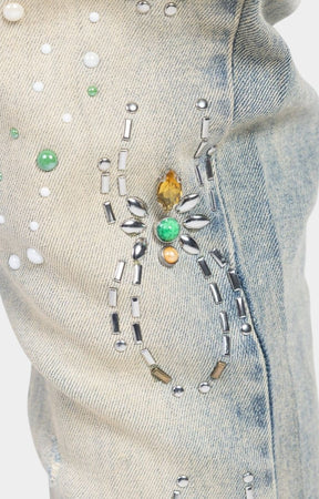 Guapi Emerald Spider designer denim jeans with rhinestone and crystal accents.