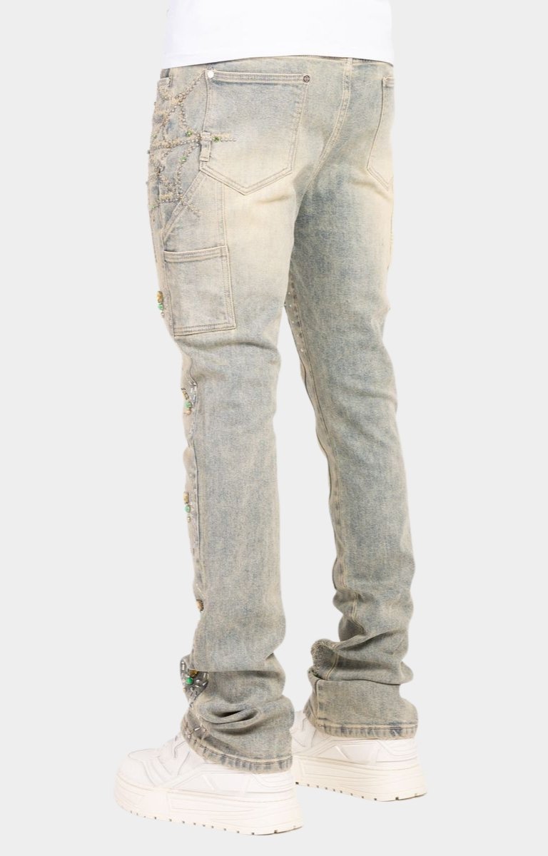 Guapi Emerald Spider rhinestone stacked denim jeans back view.