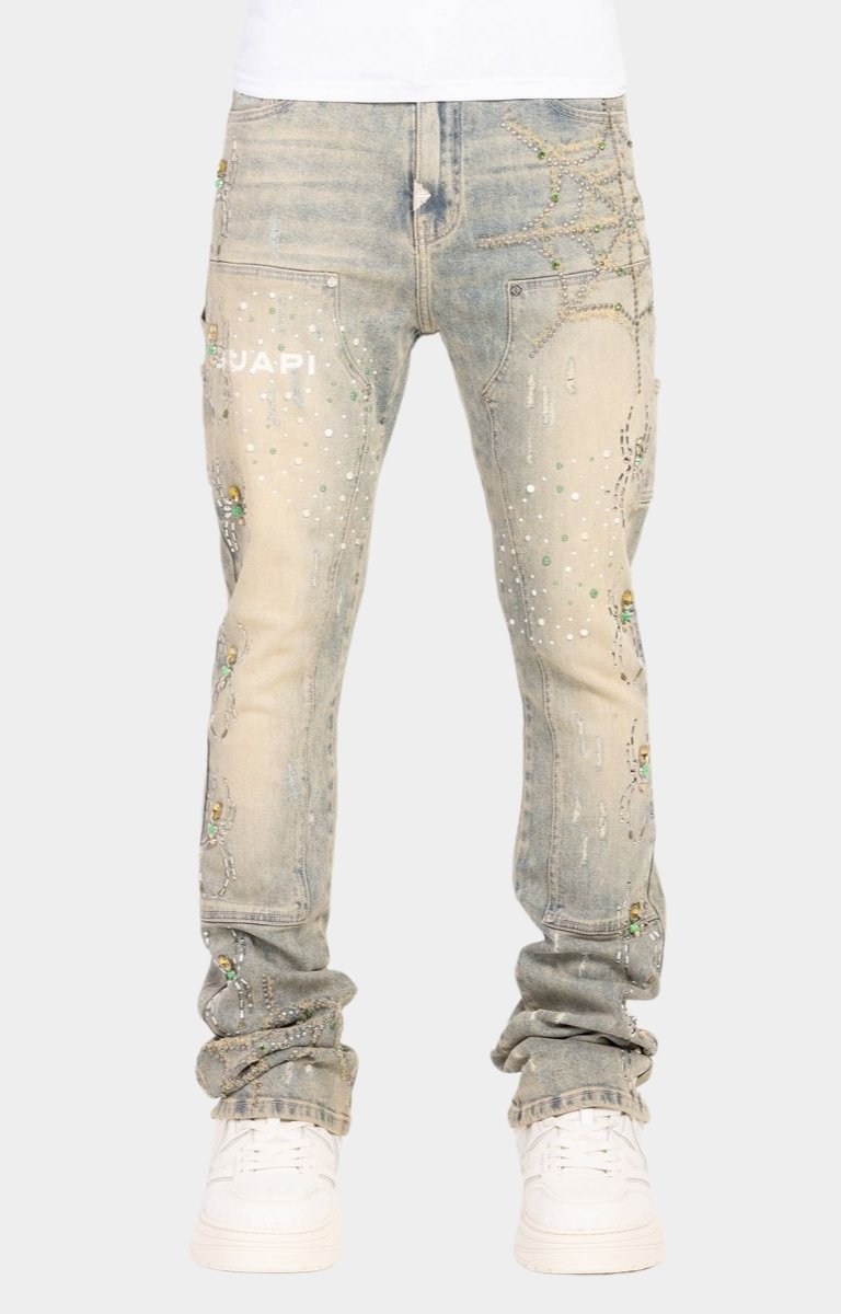 Guapi Emerald Spider rhinestone stacked denim jeans front view.