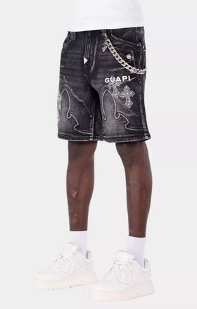 Black denim shorts with gothic cross applique panels and rhinestones.
