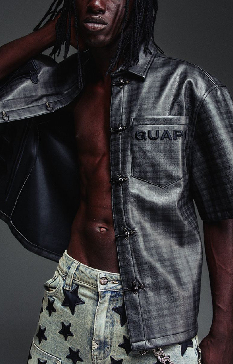Guapi All Black Grenade Leather Shirt featuring a textured leather-look finish, tonal plaid detailing, toggle closures, embroidered branding and relaxed fit.