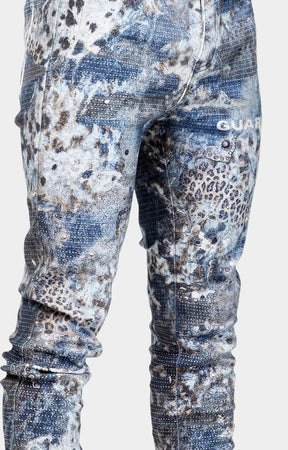 Stud embellishment detail on GUAPI Aqua Blue Hakai jeans.
