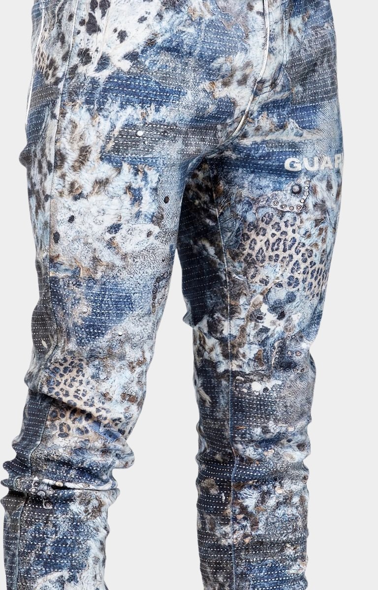 Stud embellishment detail on GUAPI Aqua Blue Hakai jeans.