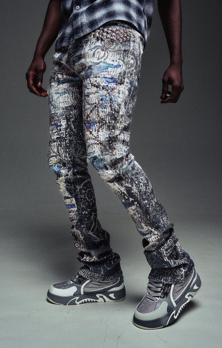 Guapi Hakai Spider graphic denim with distressed washed finish.