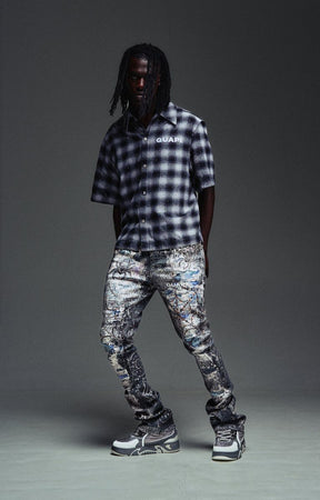 Slim stacked Guapi Hakai Spider jeans with elongated streetwear silhouette.