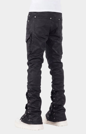 Lace-up panel with metal eyelets on lower leg on guapi black waxed rope denim. 