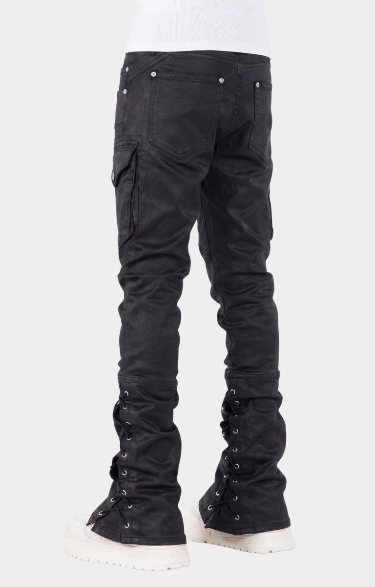 Lace-up panel with metal eyelets on lower leg on guapi black waxed rope denim. 