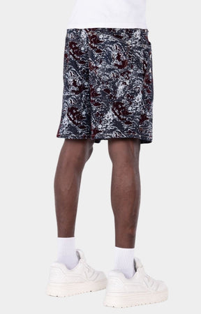 Wine red velvet shorts with laser-etched abstract marble pattern.