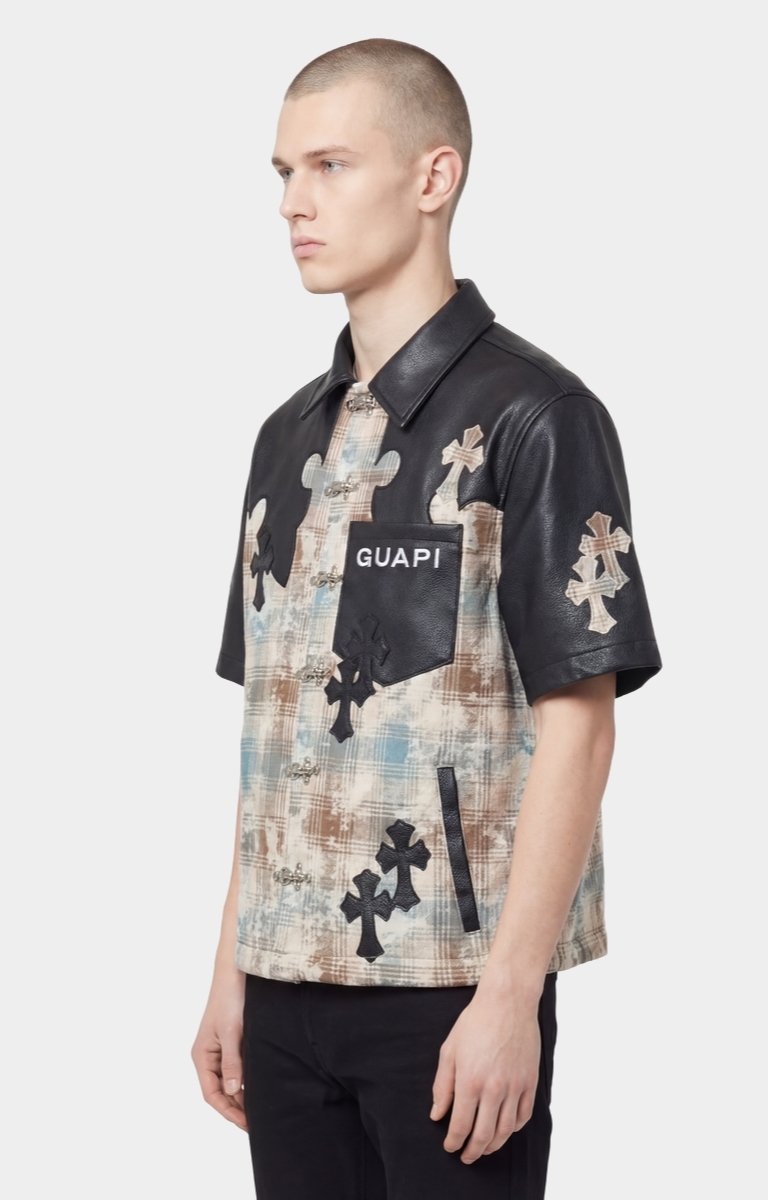 Mixed material shirt featuring premium leather sleeves and plaid front panel.