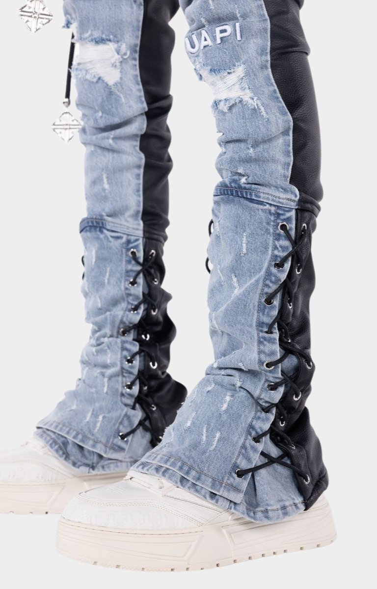Luxury cargo pants combining denim, PU leather, and utility-inspired design.