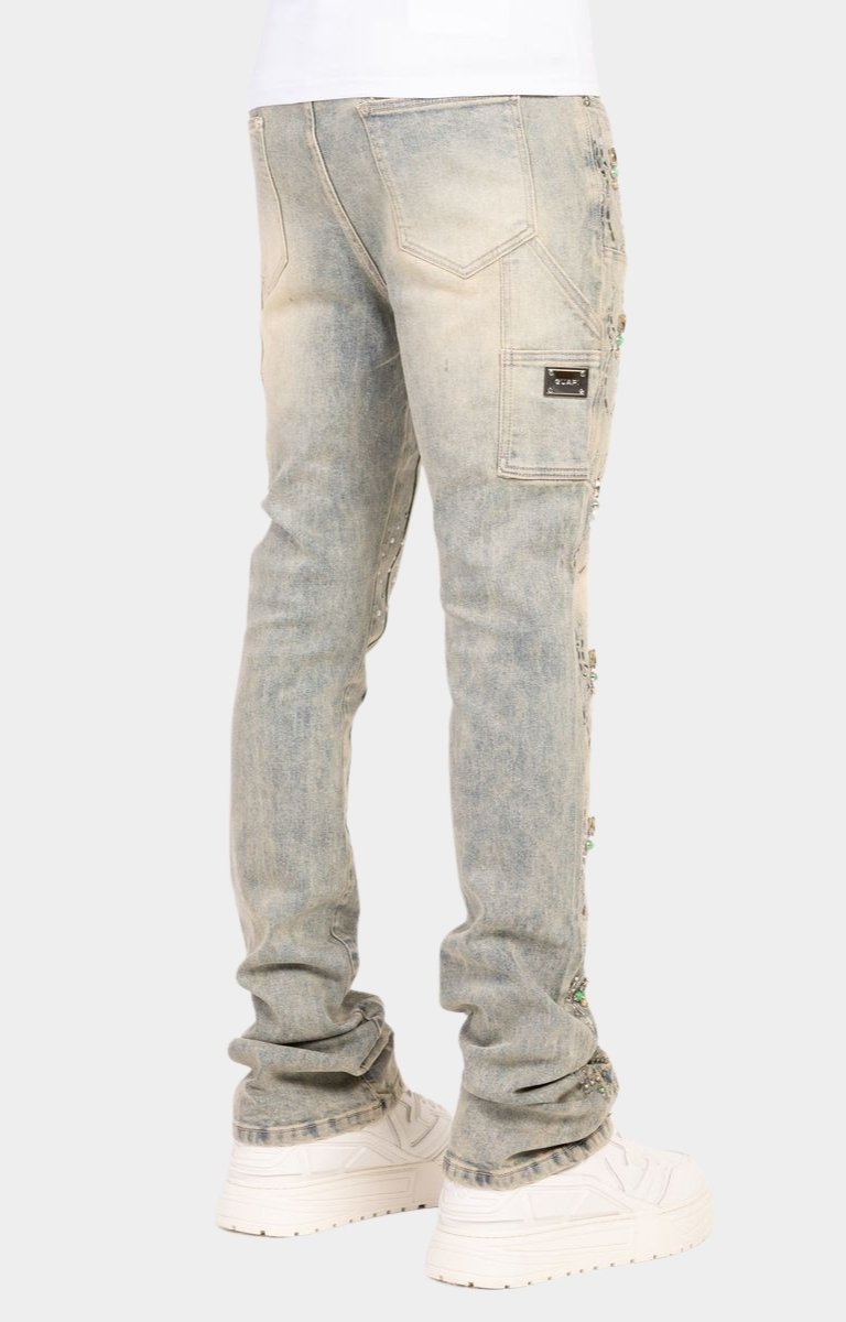 Luxury stacked denim jeans with crystal accents and premium construction.
