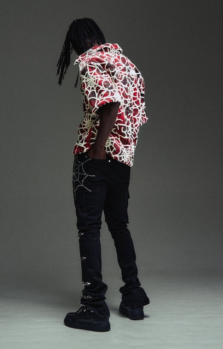 Luxury streetwear cargo denim with signature spike accents.