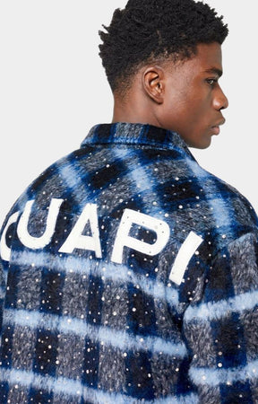 Blue and black plaid pattern detail on flannel