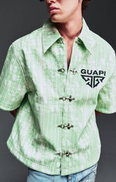 Guapi Mint Glock 17 Textured Leather Shirt featuring an all-over embossed graphic texture, metal toggle closures, structured collar, short sleeves, embroidered GUAPI logo, and relaxed streetwear fit.