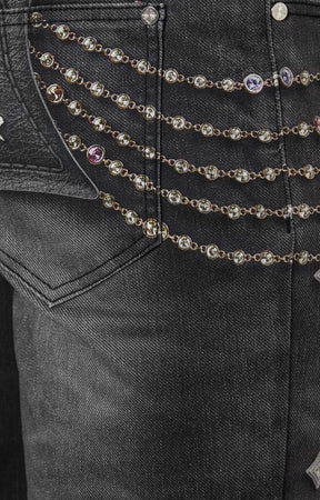 Macro shot showing faux embellishment illusion in black Heavens Vault jeans