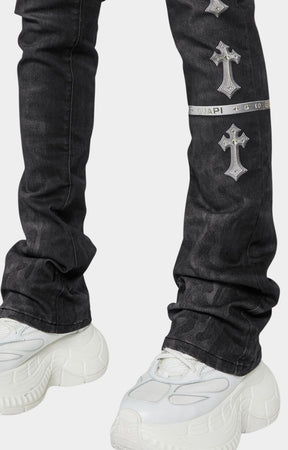 guapi obsidian black heavens vault jeans with silver cross designs withstacked fit silhouette of Guapi black denim with extended inseam