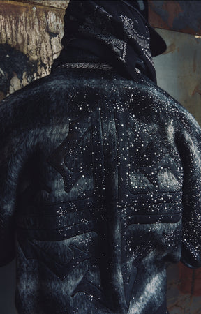 Pearl embellishments scattered across the dark textured fabric of the GUAPI Obsidian Black Plaid Jacket.
