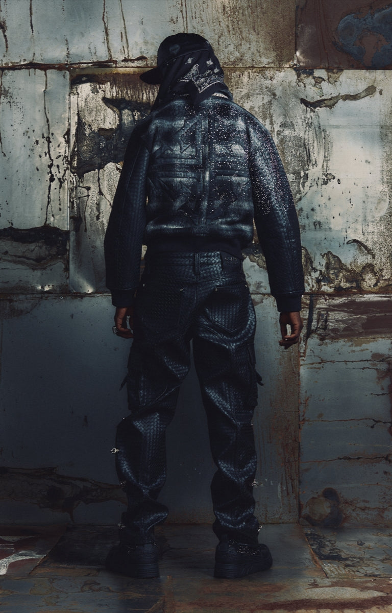 Contrasting textured sleeves on the GUAPI Obsidian Black Plaid Jacket.