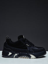 Guapi Obsidian Black Skate Star Sneakers featuring matte leather, embossed geometric detailing, oversized rope laces, padded tongue, chunky sculpted sole, and custom GUAPI branding.
