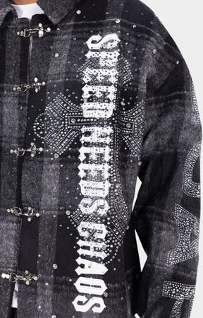 Close-up of rhinestone embellishments on Guapi SNC shirt.