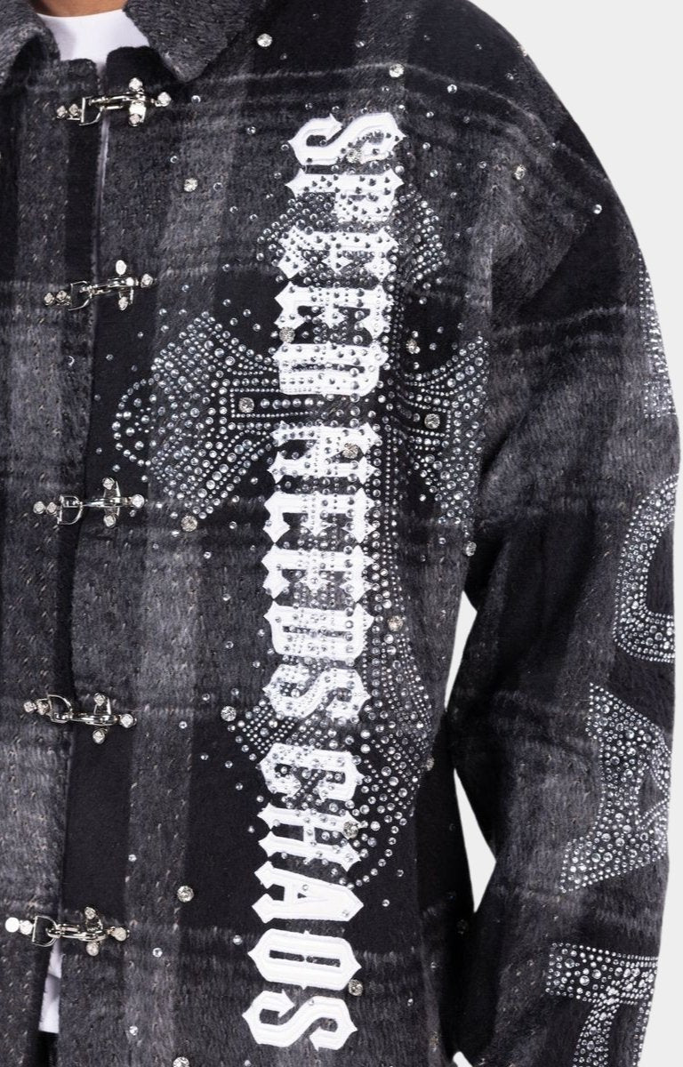Close-up of rhinestone embellishments on Guapi SNC shirt.
