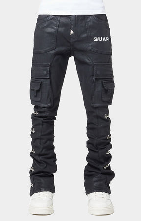 GUAPI Obsidian Black Waxed Cargo Denim crafted from heavyweight black denim with a matte wax finish, multi-panel construction, cargo pockets, silver cross-lock hardware, reinforced stitching and natural ankle stacking. Straight-slim silhouette with a true-to-size fit.