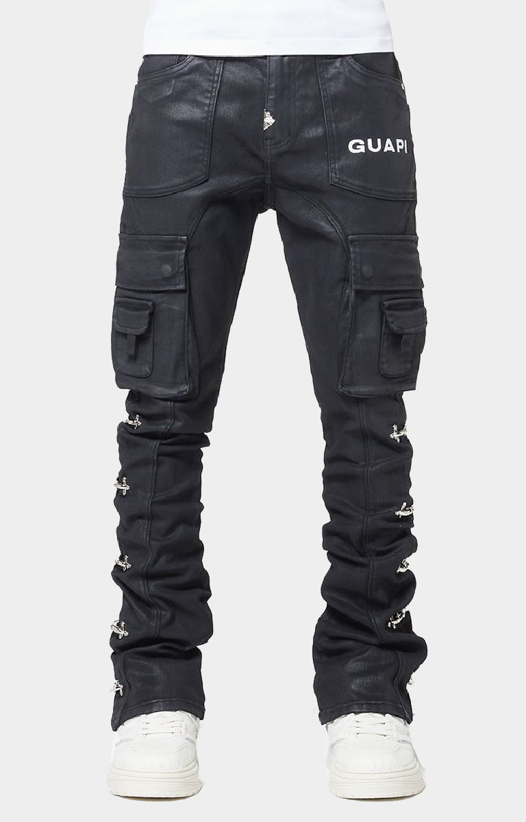 GUAPI Obsidian Black Waxed Cargo Denim crafted from heavyweight black denim with a matte wax finish, multi-panel construction, cargo pockets, silver cross-lock hardware, reinforced stitching and natural ankle stacking. Straight-slim silhouette with a true-to-size fit.