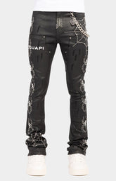 Guapi obsidian black waxed spider denim with spider web designed with rhinestones. premium guapi stacked pants with chain and metallic emblem. 