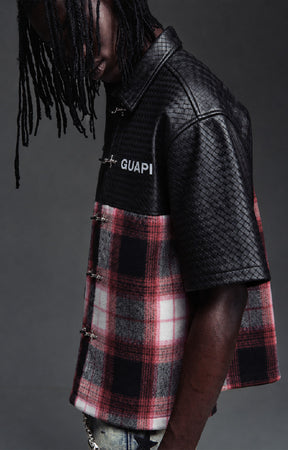 Guapi Obsidian Plaid Aviation Shirt featuring a black textured upper, black and red plaid body, metallic toggle-style closures, pointed collar and short sleeves.