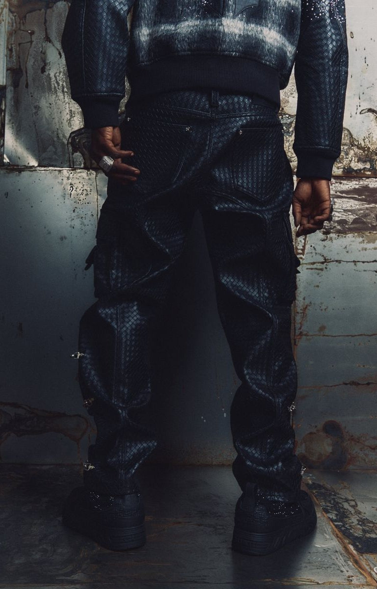 Back view of GUAPI Obsidian Woven Cargo Pants in black, showing the garment's overall design.