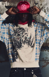 GUAPI Panther Plaid Hoodie featuring a cream body, blue-and-cream plaid panels, red plaid hood, bold panther-inspired back graphic, metallic embellishments, drawstring hood and relaxed fit.
