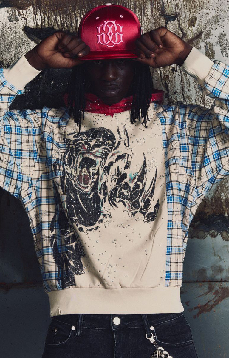 GUAPI Panther Plaid Hoodie featuring a cream body, blue-and-cream plaid panels, red plaid hood, bold panther-inspired back graphic, metallic embellishments, drawstring hood and relaxed fit.