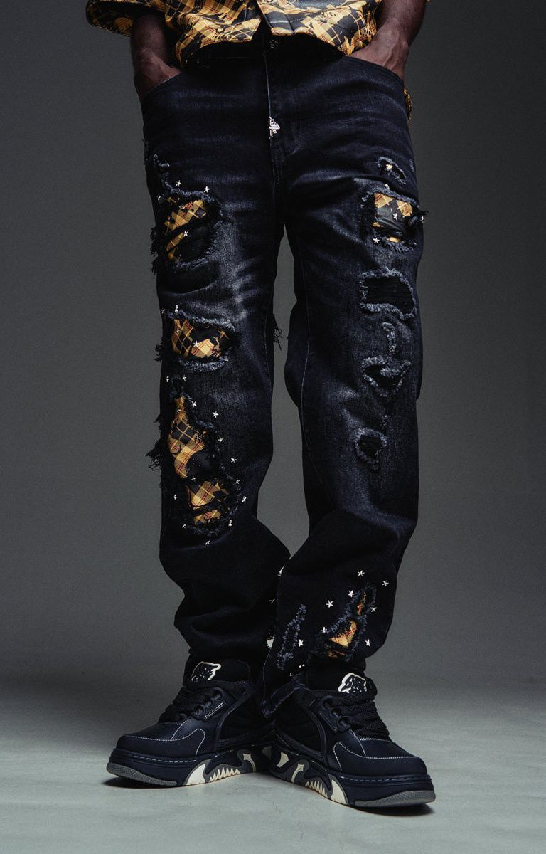 GUAPI Plaid Star Denim Jeans in Black feature dark-wash denim, distressed openings, contrasting plaid star patches, scattered star embellishments, and classic five-pocket styling. Designed with a straight-leg silhouette, these statement jeans pair easily with graphic tees, hoodies, and contemporary streetwear outfits.